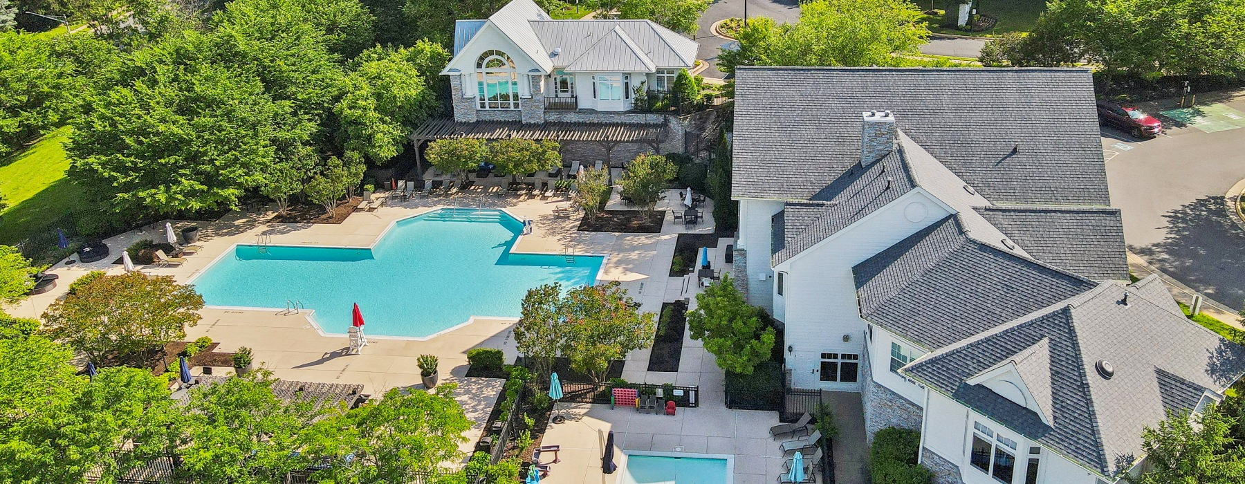 aerial view of pool and apartments