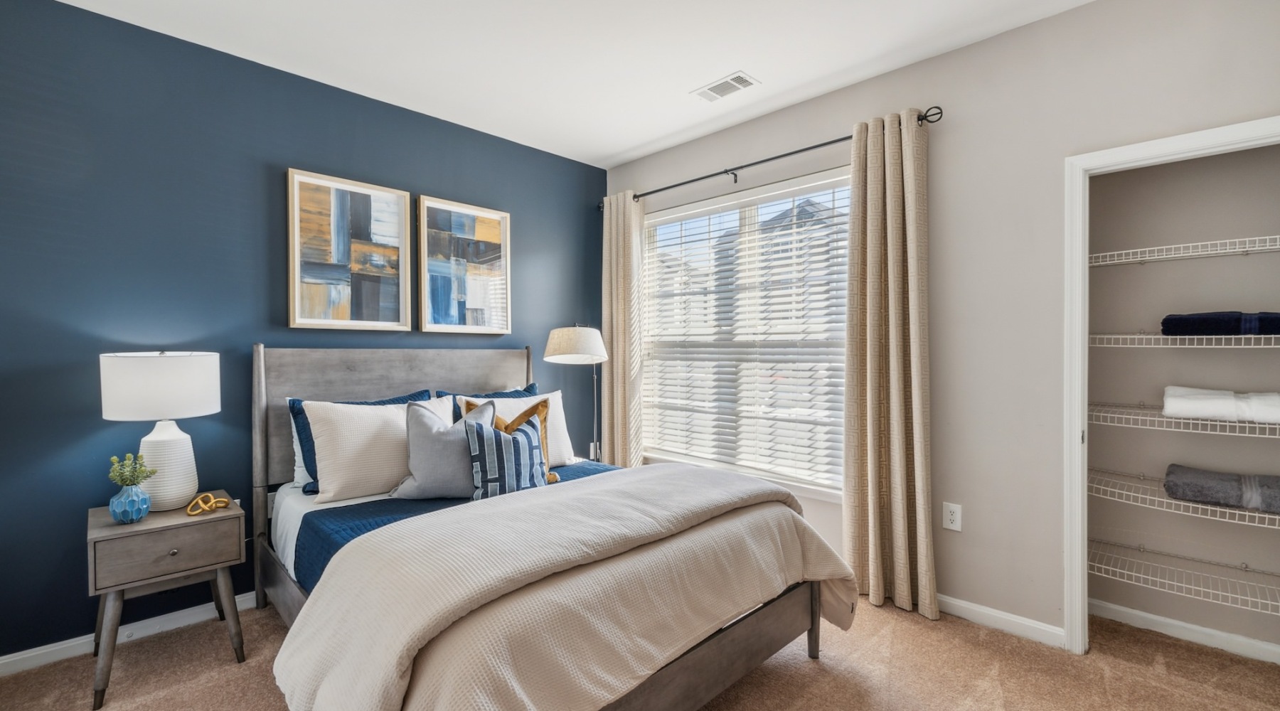 a bedroom with a bed and shelves