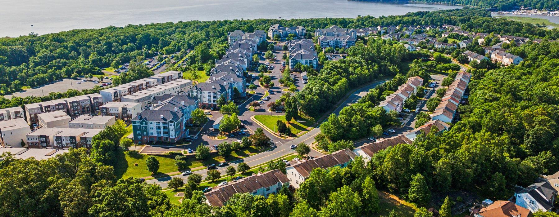 a city with trees and water in the background